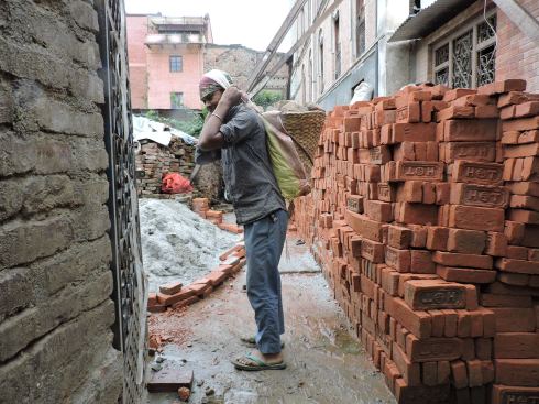 a boy doing the hard work of an adult