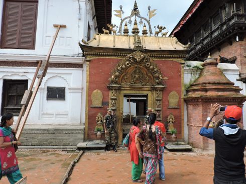 Nepalese tourists taking pictures of their cultural heritage