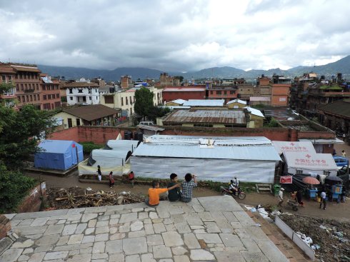 flying kites, the kites can't be seen, but kids always ask the tourists to buy them spare parts (handmade, they break easily)