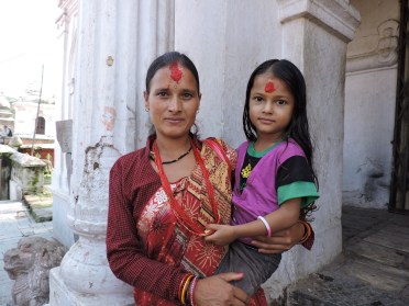 At Pashupatinath, on of the most sacred Hindu sites, mother and daughter posing for daddy with his cell phone (and for me)