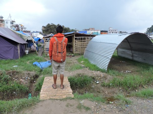 He leads me through the camp, translates, explains 