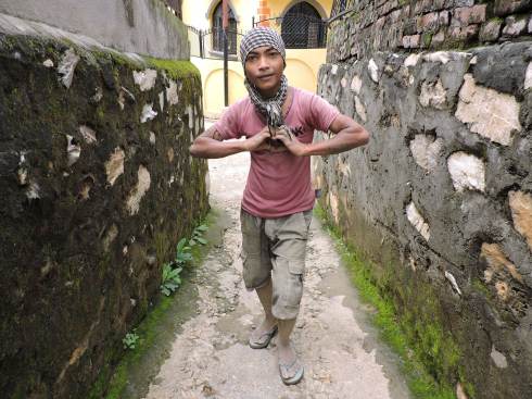 Between two heavy loads, still time to great the stranger and form a heart with his hands