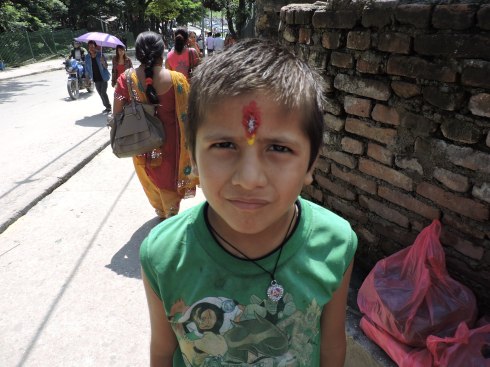 boy with tikka on his forehead, the centre of wisdom; no religious function without a tikka!