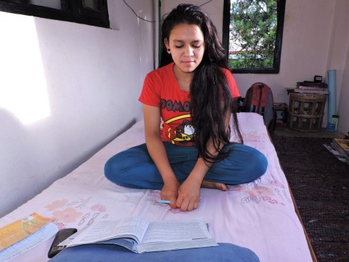 Januka studying in her room